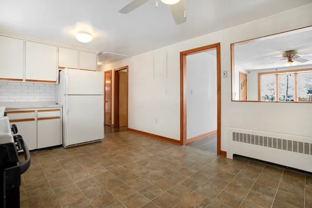 a view of a room with an empty room and a window