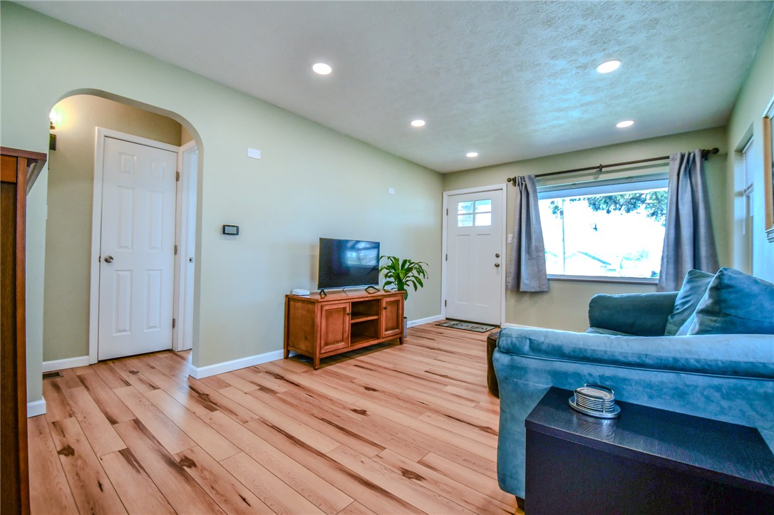 816 South Smithville Road Dayton, OH 45403 - Photo 9 of 33 This inviting living space features gleaming hardwood floors and ample natural light, creating a welcoming atmosphere.