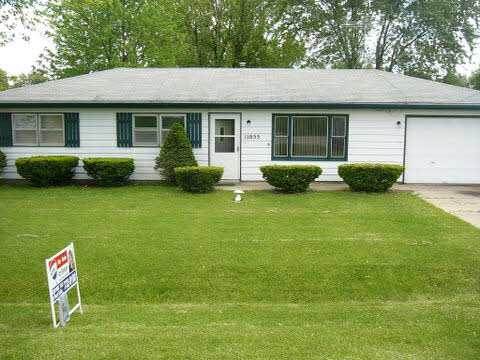 11055 East Fisher Road Rochelle, IL 61068 - Photo 1 of 5 a view of a house with a backyard and sitting area