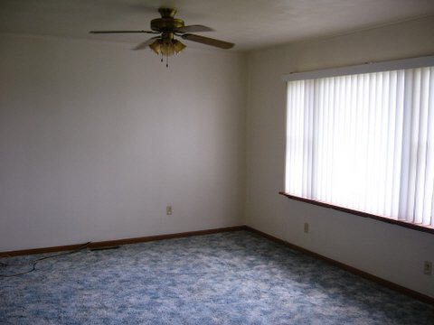 11055 East Fisher Road Rochelle, IL 61068 - Photo 4 of 5 an empty room with a window
