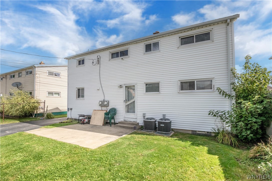 31 Wellington Road Cheektowaga, NY 14225 - Photo 43 of 46 Patio, rear door & air conditioners