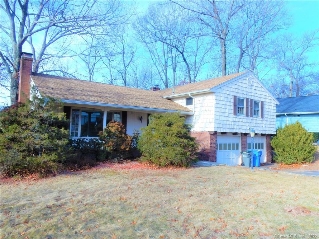 a front view of a house with garden and porch