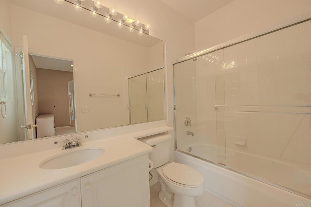 1370 Cassins Street Carlsbad, CA 92011 - Photo 15 of 35 a bathroom with a sink a toilet and shower
