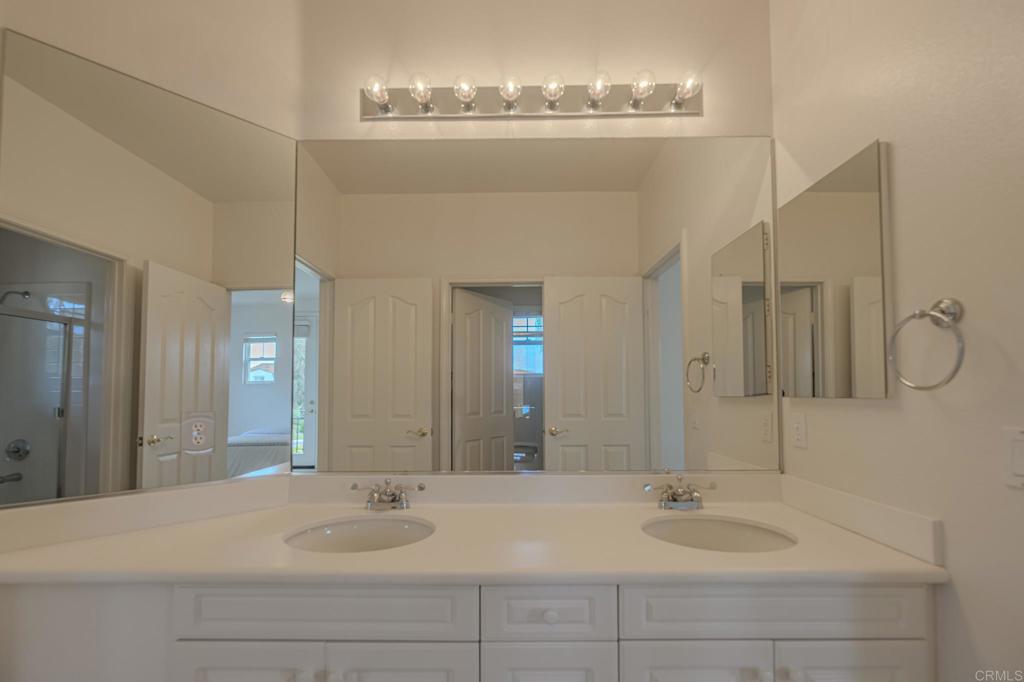 1370 Cassins Street Carlsbad, CA 92011 - Photo 20 of 35 a bathroom with a sink and a mirror