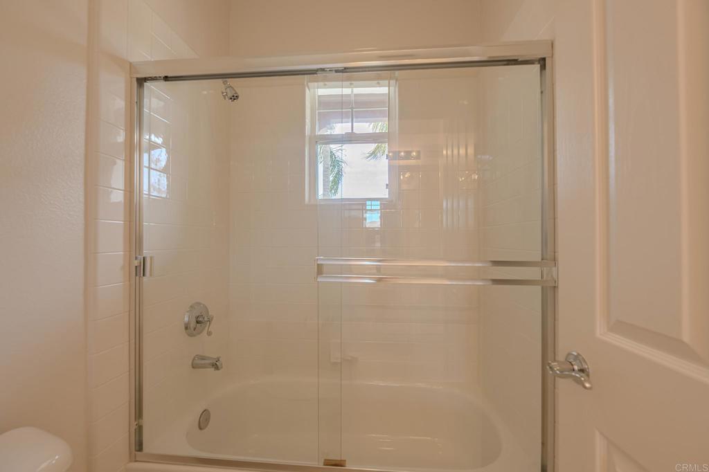 1370 Cassins Street Carlsbad, CA 92011 - Photo 21 of 35 a bathroom with a glass shower door