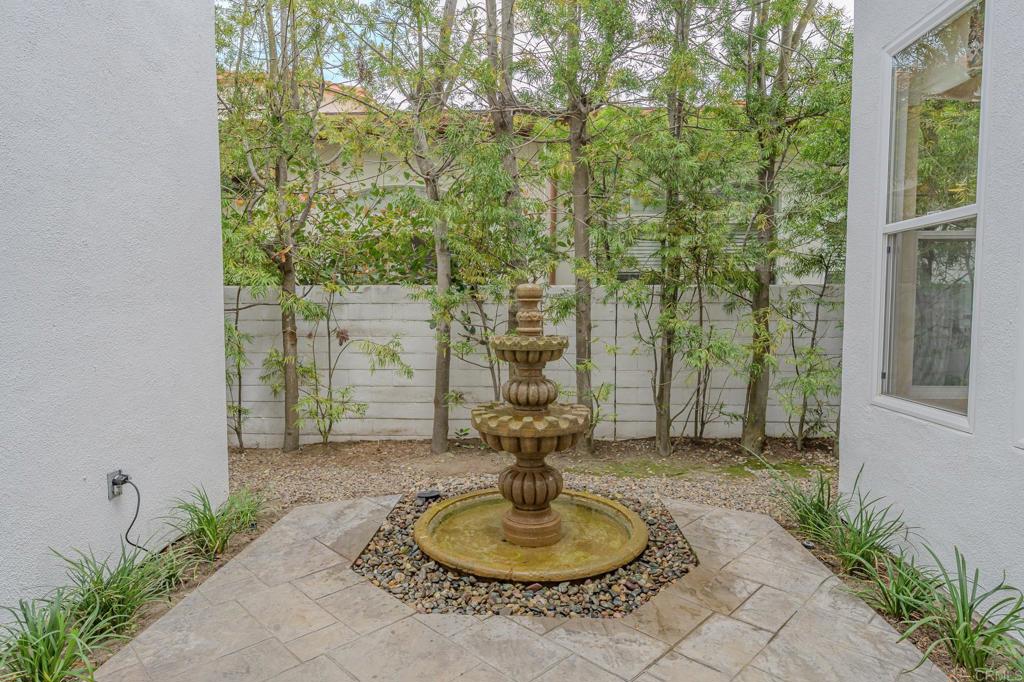 1370 Cassins Street Carlsbad, CA 92011 - Photo 28 of 35 a backyard of a house with outdoor seating