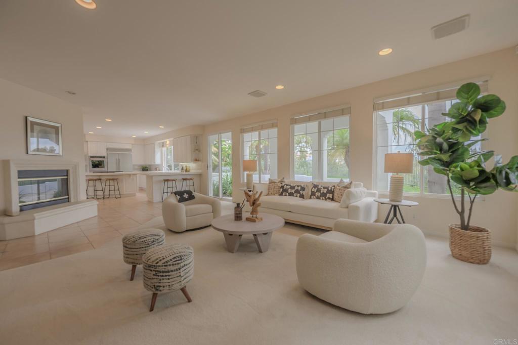 1370 Cassins Street Carlsbad, CA 92011 - Photo 4 of 35 a living room with furniture potted plant and a fireplace