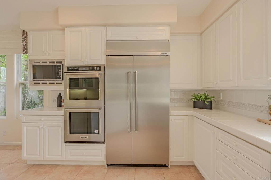 1370 Cassins Street Carlsbad, CA 92011 - Photo 10 of 35 a kitchen with stainless steel appliances a refrigerator sink and microwave