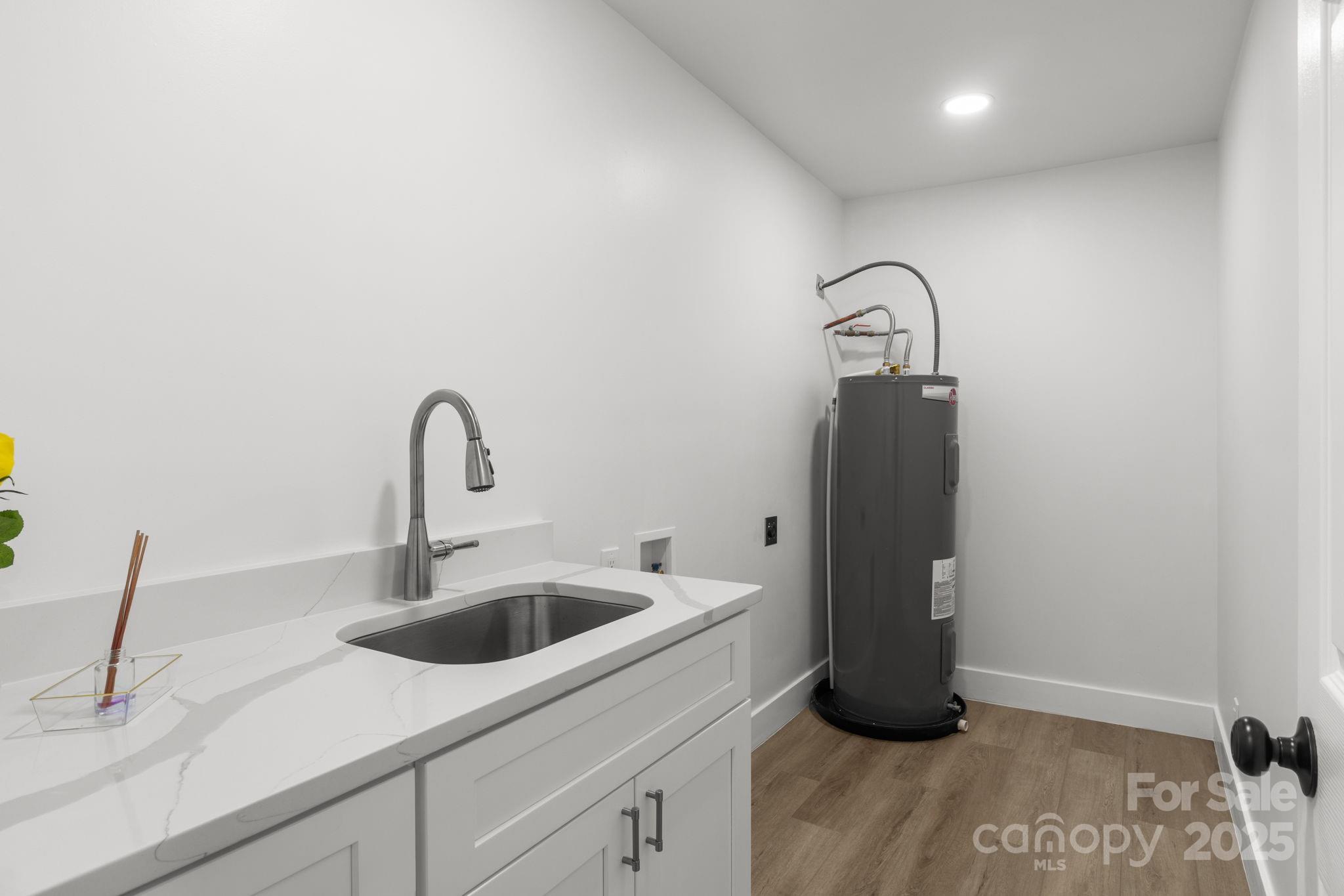 809 Miller Street Gastonia, NC 28052 - Photo 12 of 19 a kitchen with a sink and a refrigerator