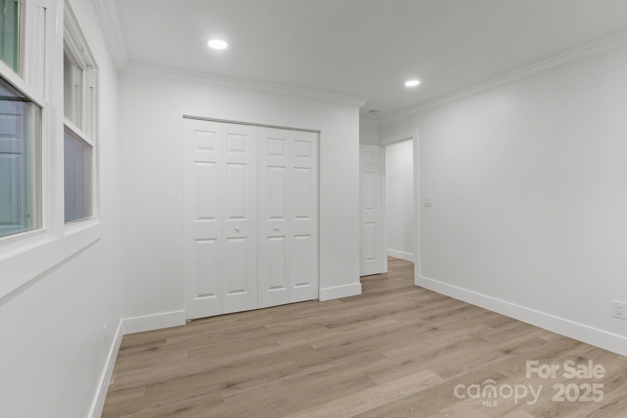 809 Miller Street Gastonia, NC 28052 - Photo 16 of 19 wooden floor in an empty room with a window