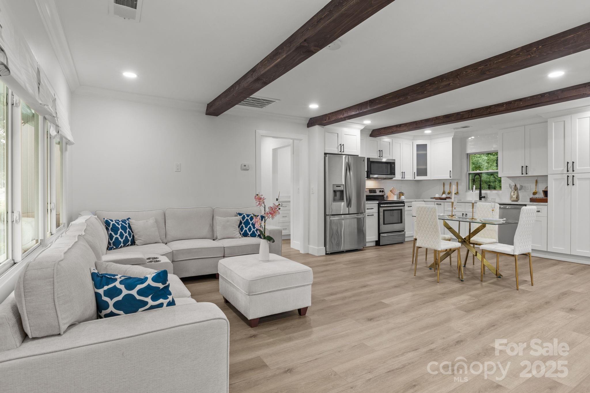 809 Miller Street Gastonia, NC 28052 - Photo 5 of 19 a living room with furniture and kitchen view