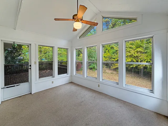 a view of room with window and ceiling fan