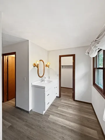 a view of kitchen with furniture and wooden floor