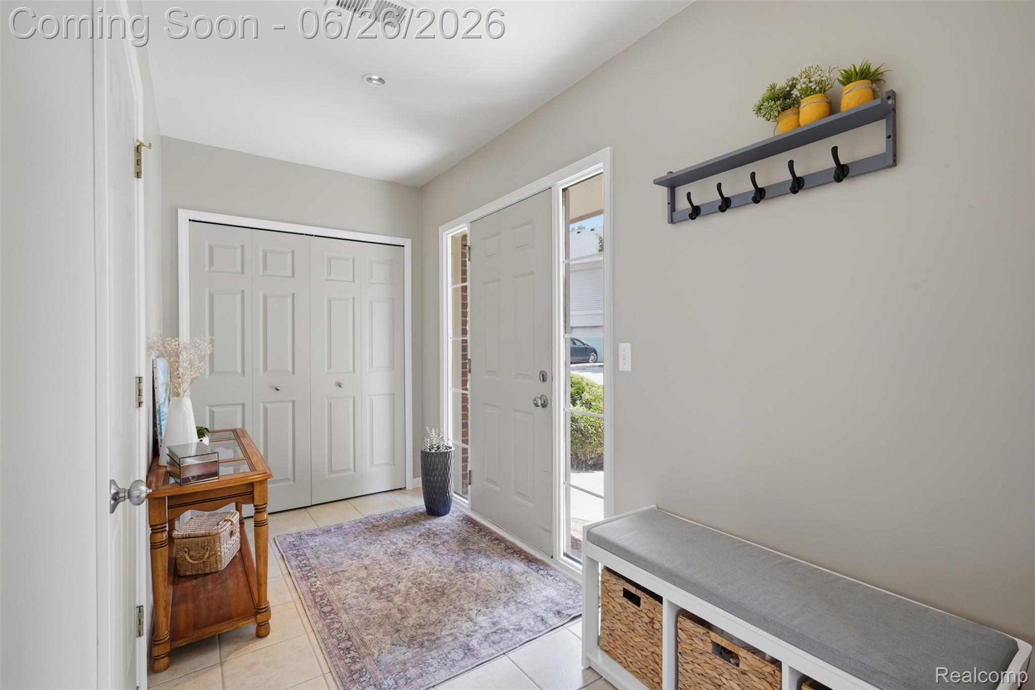 1668 Deepwood Circle Rochester, MI 48307 - Photo 5 of 27 Entryway featuring light neutral wall paint, tile flooring, and a front door with a sidelight