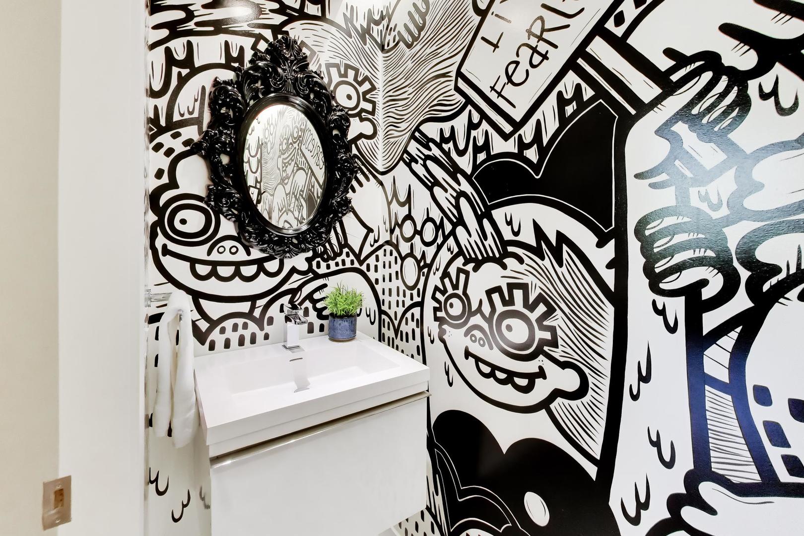 1000 West Washington Boulevard, Unit 145 Chicago, IL 60607 - Photo 14 of 45 a bathroom with a sink and a mirror