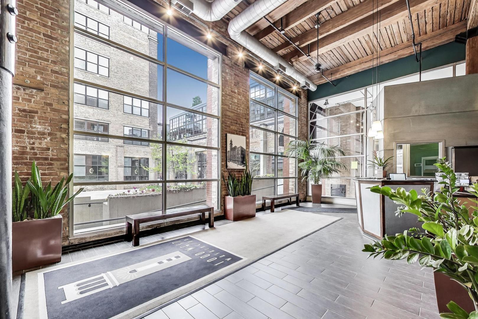 1000 West Washington Boulevard, Unit 145 Chicago, IL 60607 - Photo 2 of 45 a sitting area with benches in front of it