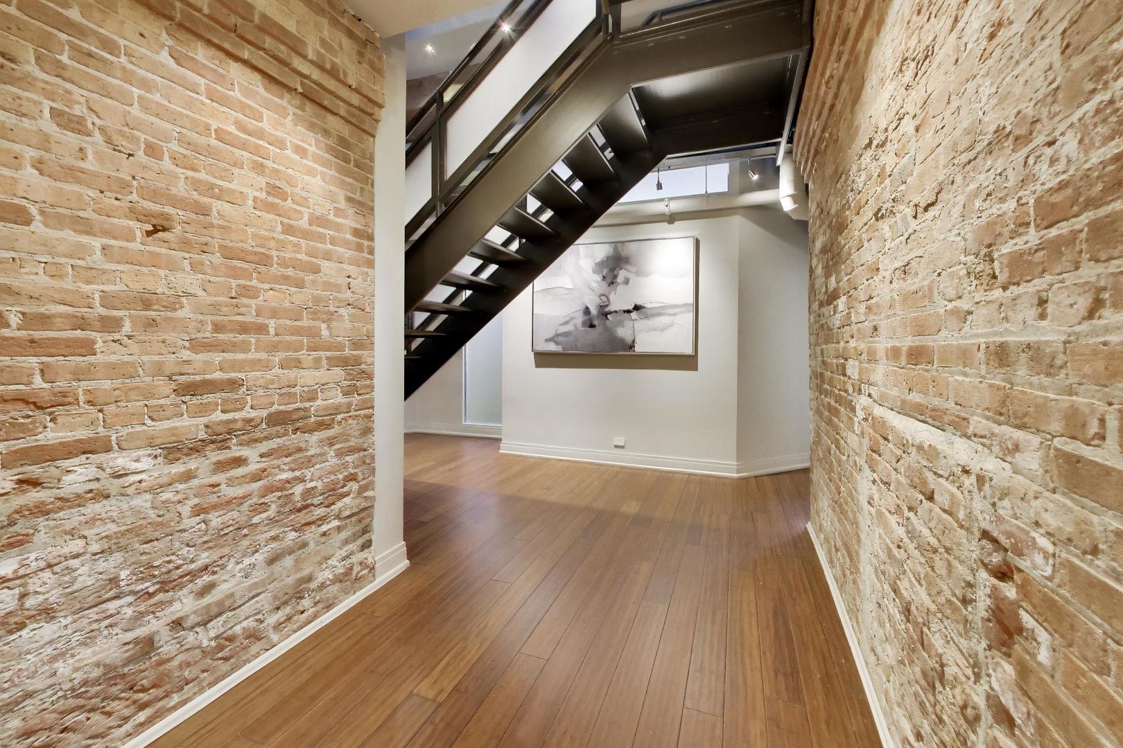 1000 West Washington Boulevard, Unit 145 Chicago, IL 60607 - Photo 25 of 45 a view of entryway with wooden floor