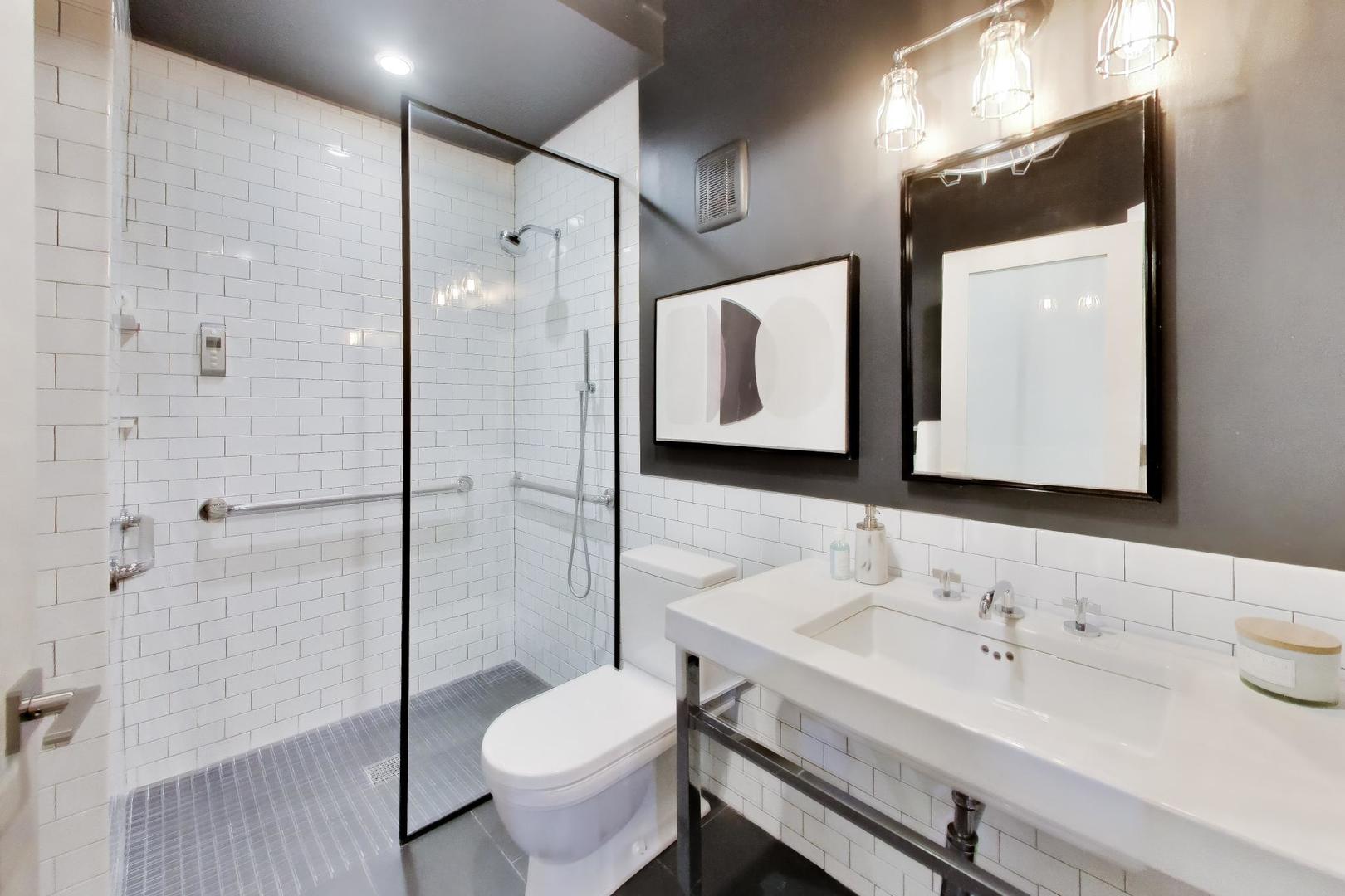1000 West Washington Boulevard, Unit 145 Chicago, IL 60607 - Photo 38 of 45 a bathroom with a sink and a mirror