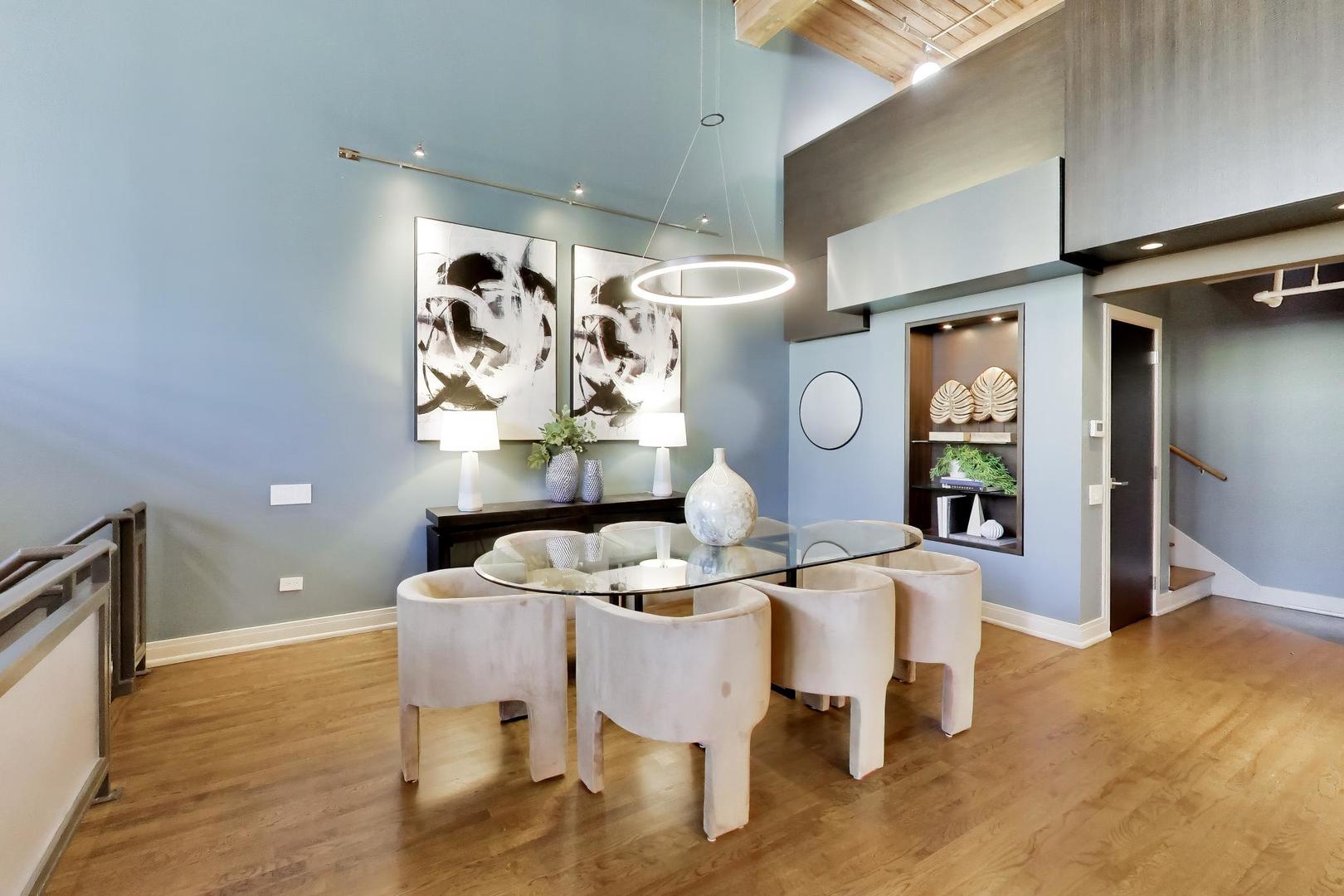 1000 West Washington Boulevard, Unit 145 Chicago, IL 60607 - Photo 7 of 45 a dining room with furniture and wooden floor