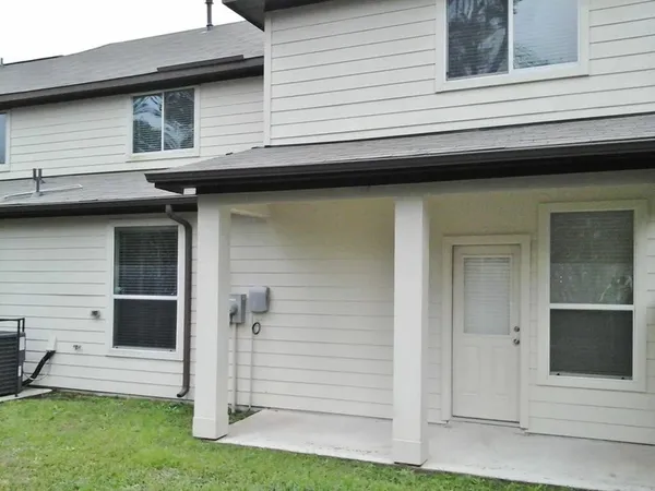 a view of a house with a door and a porch