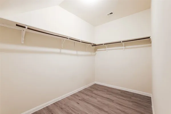 a view of an empty walk in closet