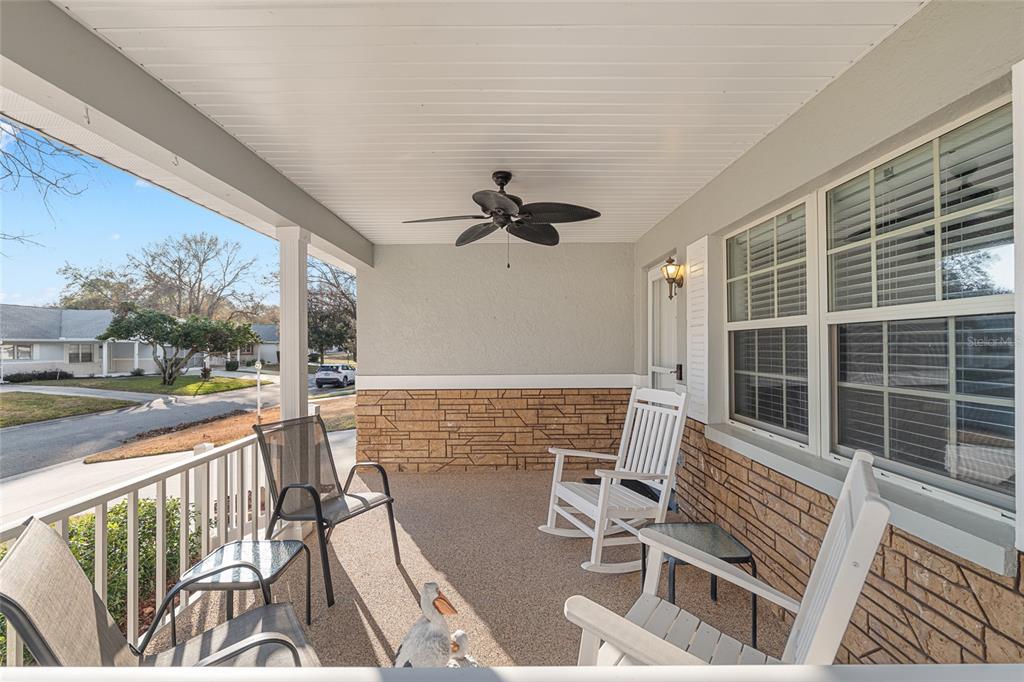 8889 Southwest 96th Street, Unit E Ocala, FL 34481 - Photo 3 of 40 a view of balcony with wooden floor and outdoor seating