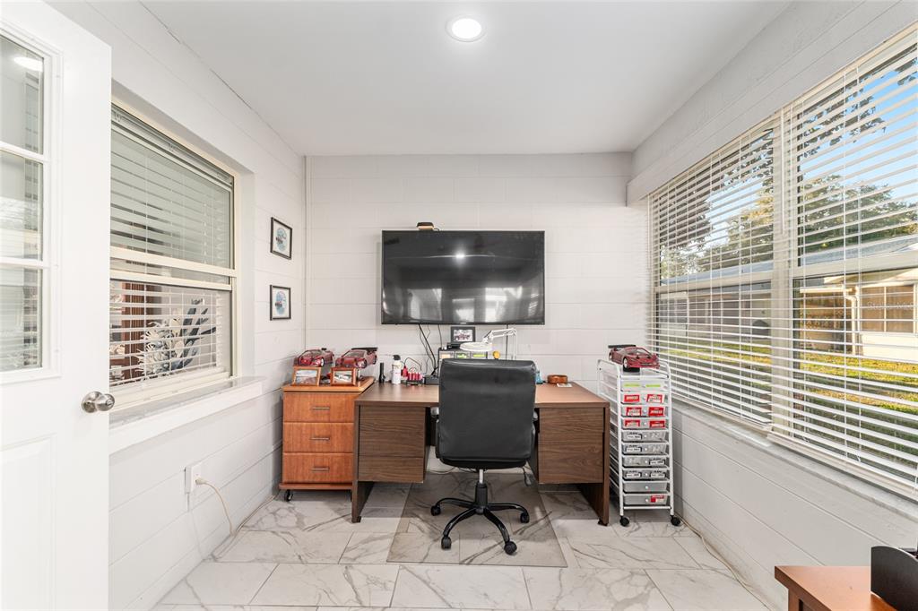 8889 Southwest 96th Street, Unit E Ocala, FL 34481 - Photo 31 of 40 a workspace with furniture and a window