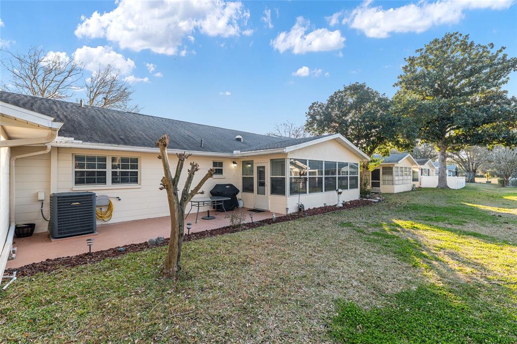 8889 Southwest 96th Street, Unit E Ocala, FL 34481 - Photo 35 of 40 a front view of a house with garden
