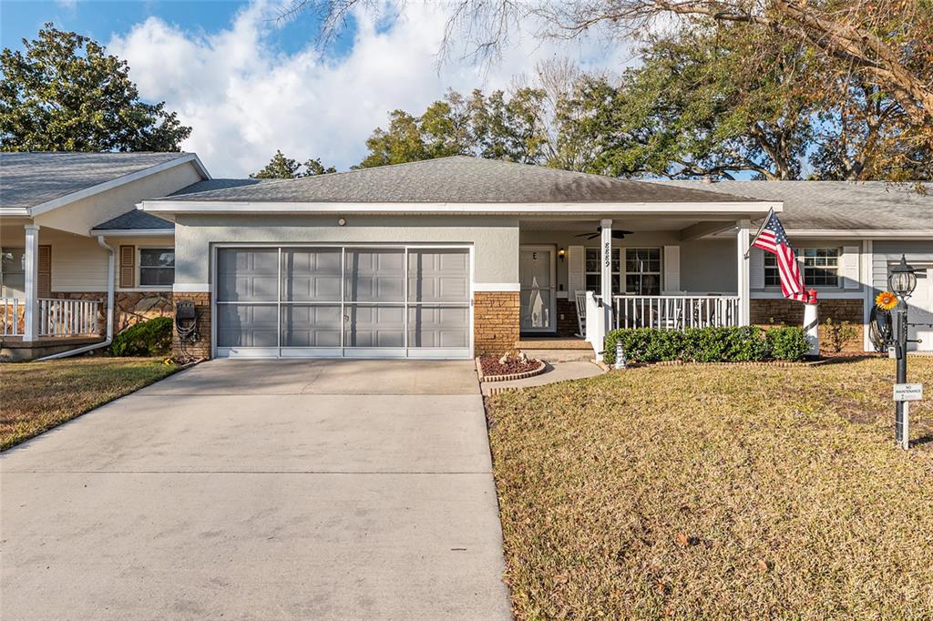 8889 Southwest 96th Street, Unit E Ocala, FL 34481 - Photo 37 of 40 front view of a house with a yard