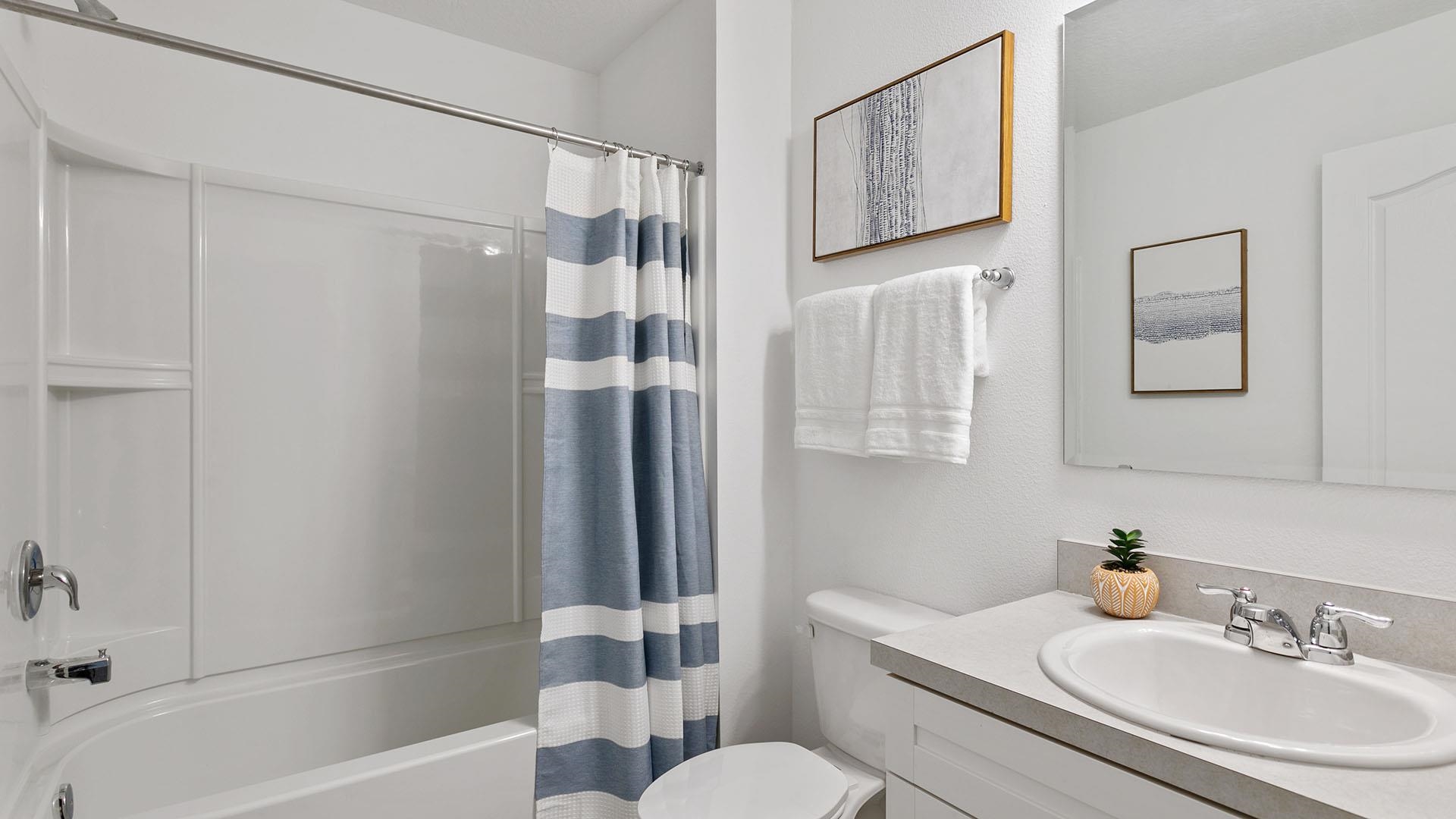 25 Redbud Road Palm Coast, FL 32137 - Photo 21 of 33 a bathroom with a sink toilet and shower