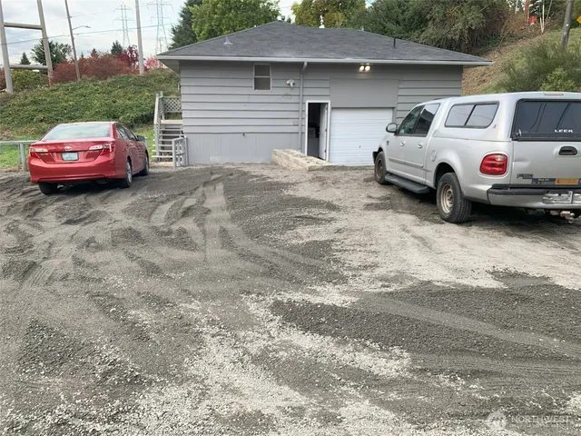 a front view of a house with parking