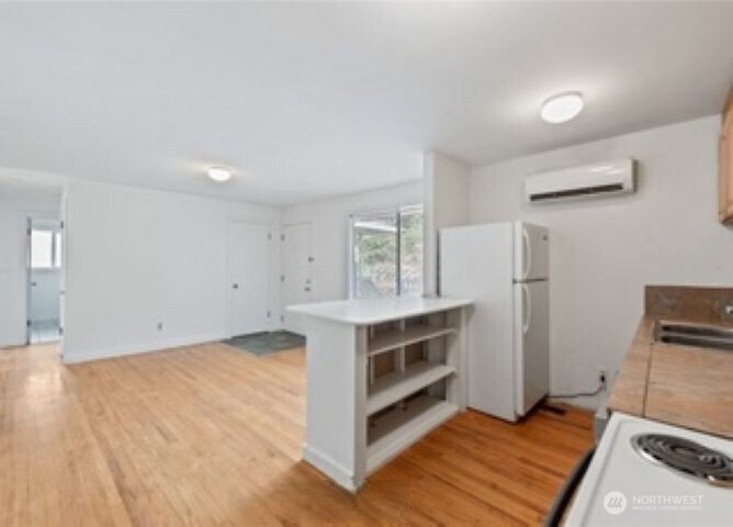 10601 55th Avenue South Seattle, WA 98178 - Photo 15 of 26 a kitchen with a stove and a refrigerator