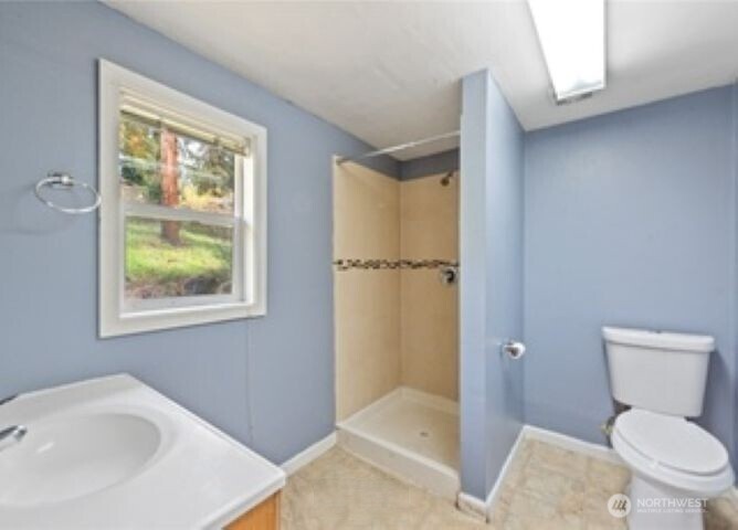 10601 55th Avenue South Seattle, WA 98178 - Photo 25 of 26 a bathroom with a sink and a toilet