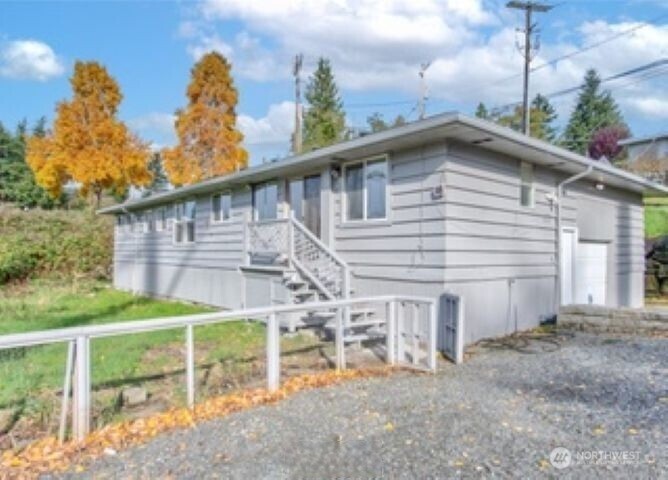 10601 55th Avenue South Seattle, WA 98178 - Photo 3 of 26 a view of a house with backyard and porch