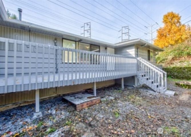 10601 55th Avenue South Seattle, WA 98178 - Photo 5 of 26 a view of a house with a yard and deck