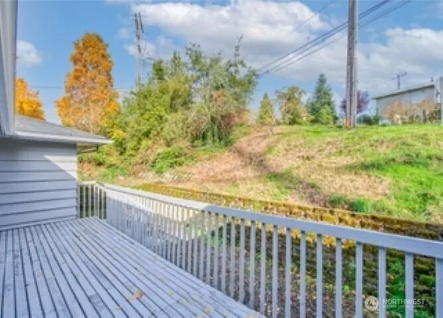 a view of a balcony with wooden floor