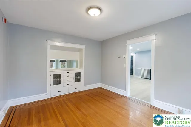 a bedroom with a bed and cabinets