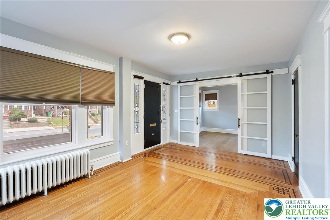 1150 North 19th Street, Unit 1 Allentown, PA 18104 - Photo 13 of 32 a bedroom with a bed and a window
