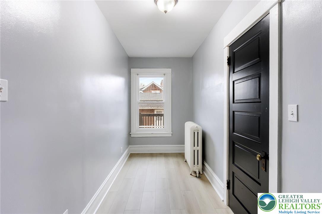 1150 North 19th Street, Unit 1 Allentown, PA 18104 - Photo 22 of 32 a view of hallway with stairs and a window