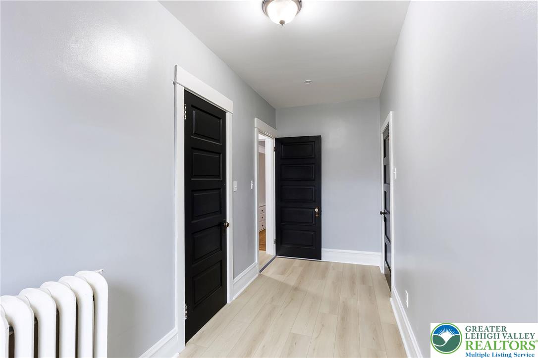 1150 North 19th Street, Unit 1 Allentown, PA 18104 - Photo 23 of 32 a view of hallway with stairs and wooden floor
