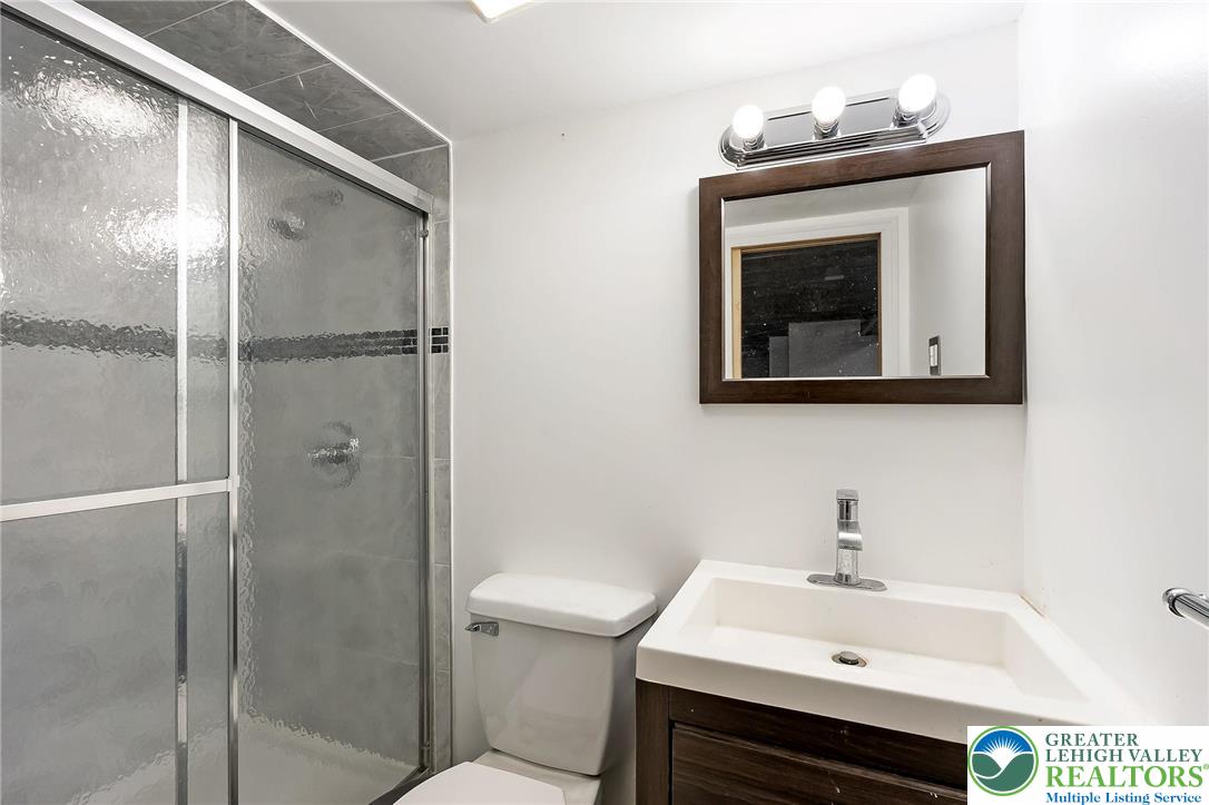 1150 North 19th Street, Unit 1 Allentown, PA 18104 - Photo 24 of 32 a bathroom with a sink toilet and vanity