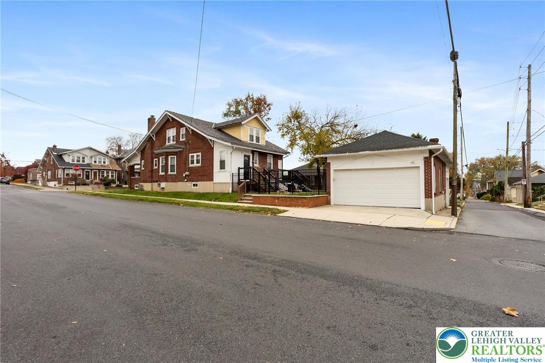 1150 North 19th Street, Unit 1 Allentown, PA 18104 - Photo 30 of 32 a car parked in front of house with yard