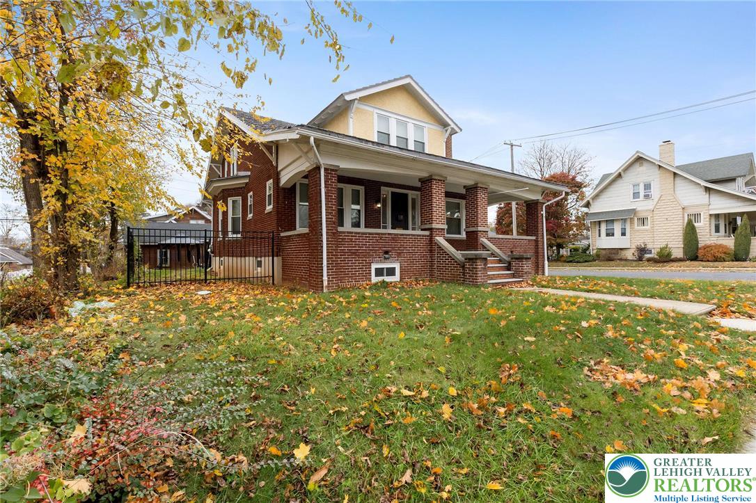 1150 North 19th Street, Unit 1 Allentown, PA 18104 - Photo 3 of 32 a front view of a house with a yard