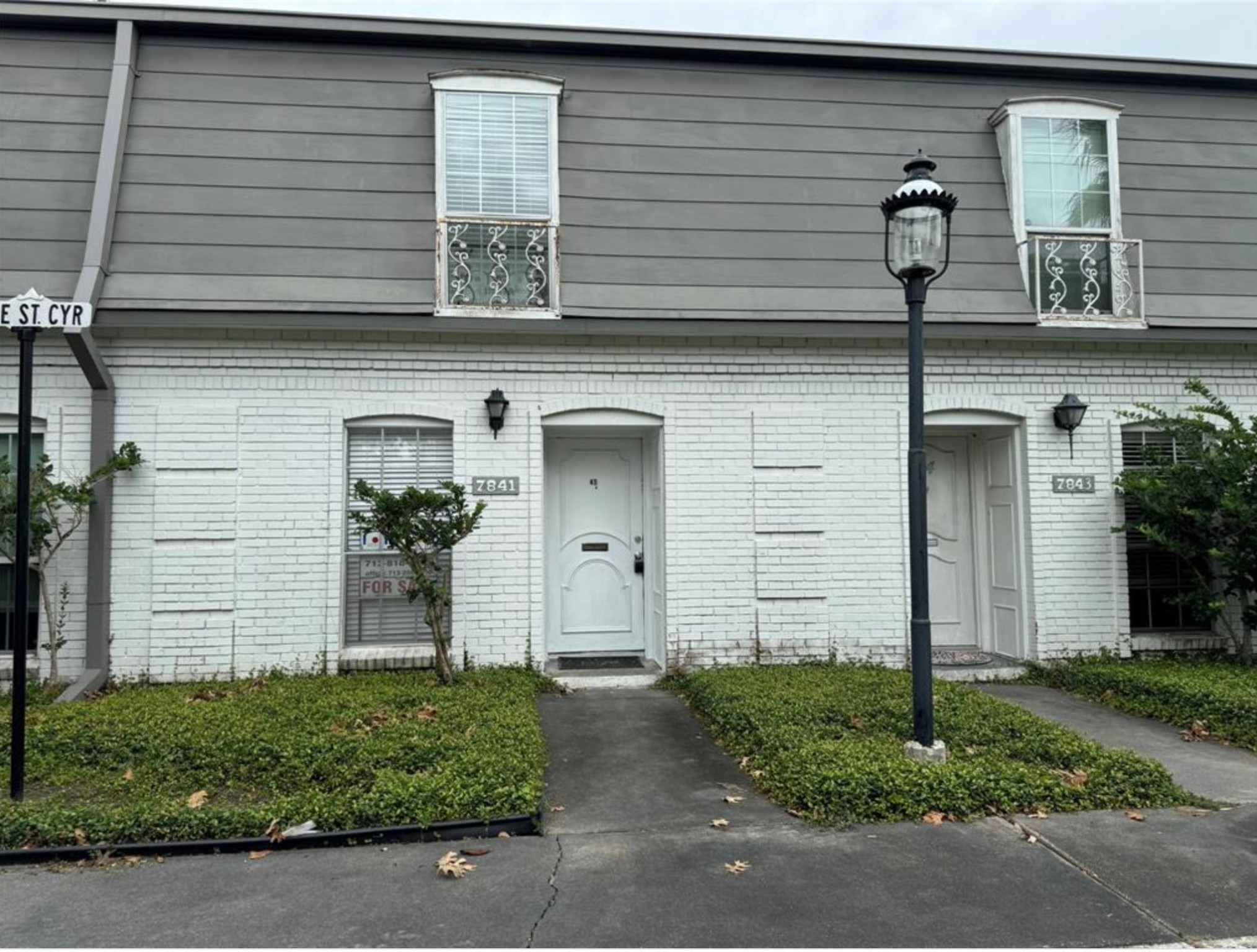 7841 Rue St Cyr Street, Unit 45 Houston, TX 77074 - Photo 1 of 7 front view of a house with a small yard