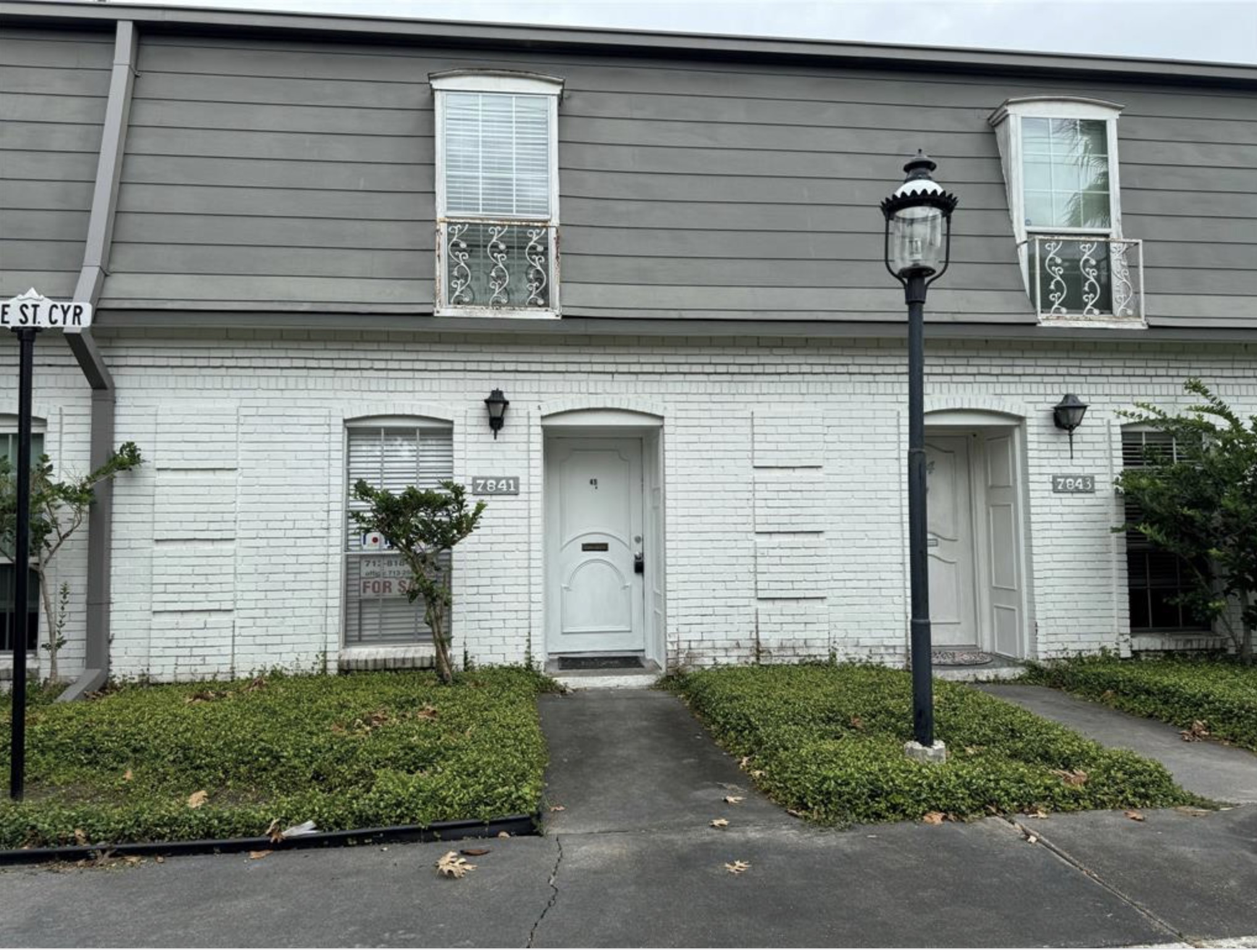 7841 Rue St Cyr Street, Unit 45 Houston, TX 77074 - Photo 1 of 7 front view of a house with a small yard