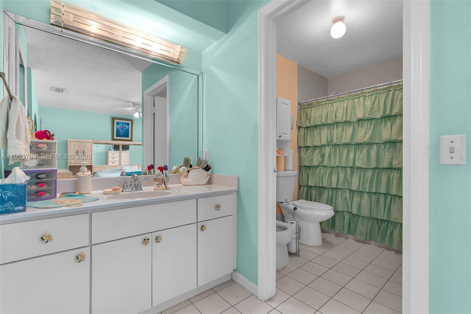 1002 Southwest 142nd Court Miami, FL 33184 - Photo 11 of 50 a bathroom with a toilet sink and shower