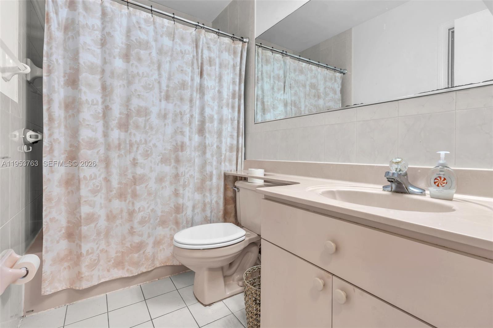1002 Southwest 142nd Court Miami, FL 33184 - Photo 13 of 50 a bathroom with a sink a toilet and shower