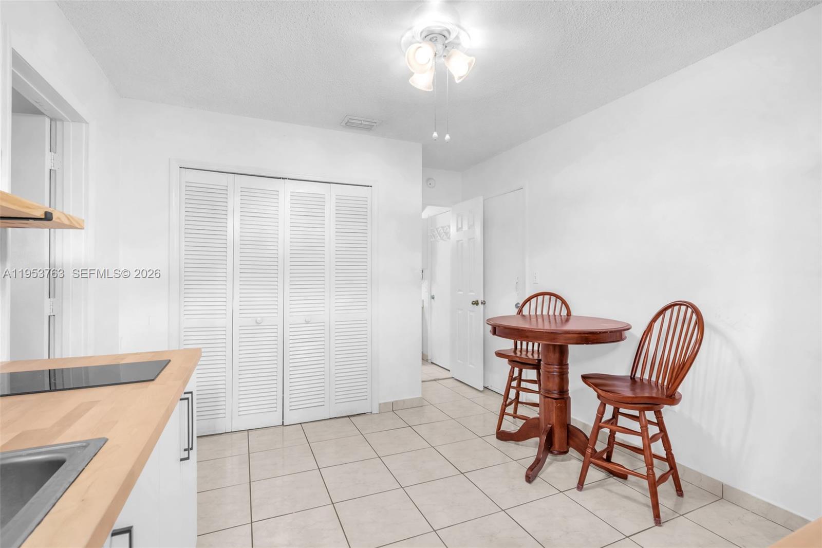 1002 Southwest 142nd Court Miami, FL 33184 - Photo 18 of 50 a view of a room with furniture and wooden floor