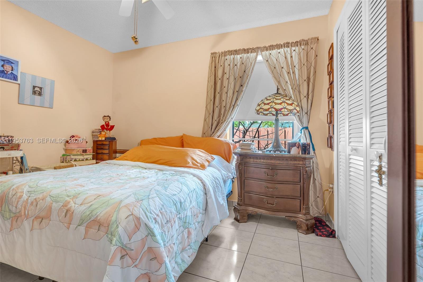 1002 Southwest 142nd Court Miami, FL 33184 - Photo 20 of 50 a bedroom with a bed and a window