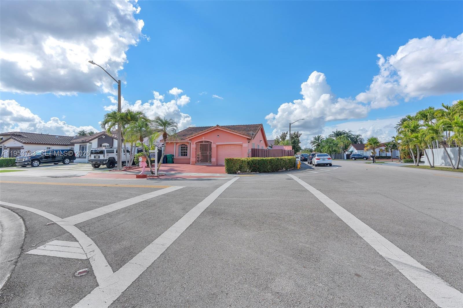 1002 Southwest 142nd Court Miami, FL 33184 - Photo 31 of 50 a group of cars parked in front of a building